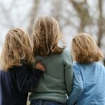 2 women in blue and gray sweaters